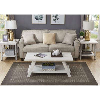 Table basse contemporaine blanche avec tablette et tables de bout jumelées