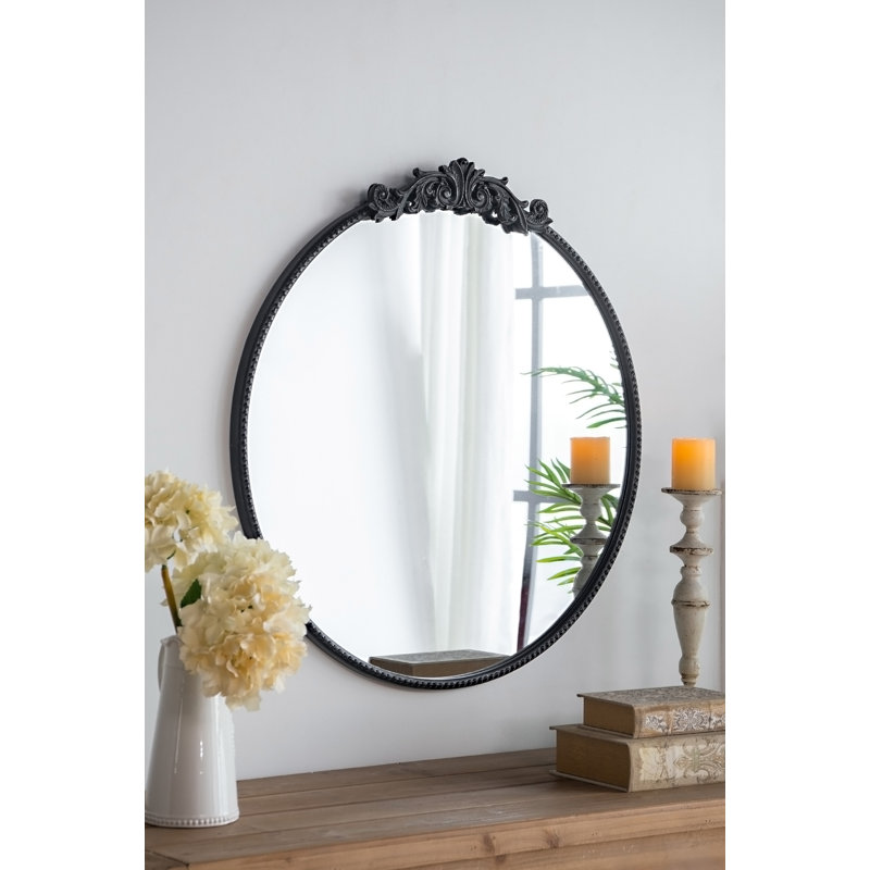 Miroir avec forme ronde et cadre d'inspiration baroque