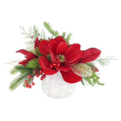 Arrangement Holiday Magnolia avec feuilles vertes et baies dans un vase décoratif en céramique