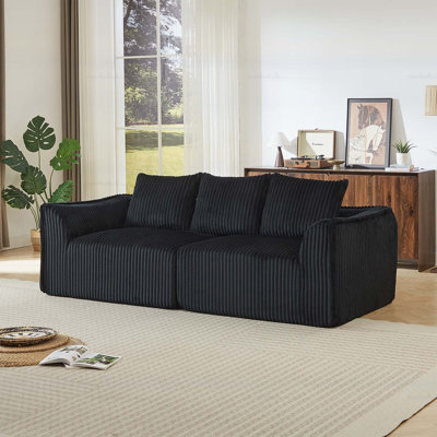 Minimalist 3-seater Corduroy Sofa with Curved Lines, Gently Sloped Backrest, and Three Throw Pillows for Modern Comfort