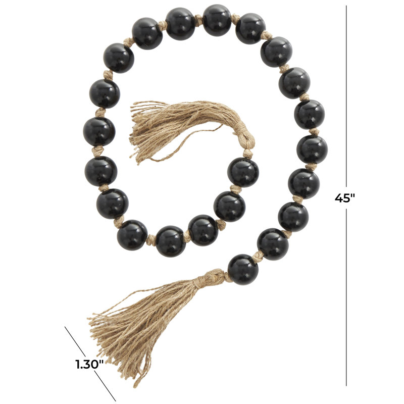 Guirlande perlée noire en verre avec pampille et jute noué à la main