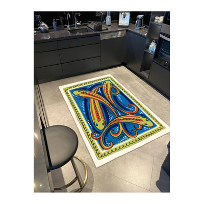 Tapis bleu tissé à motif de poisson