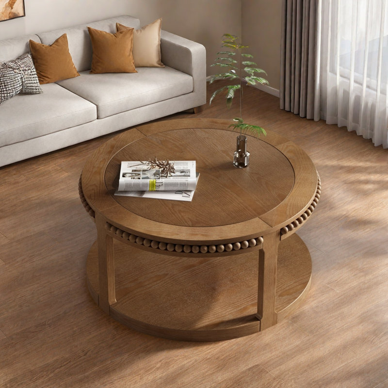 Table basse ronde avec plateau épaissi à deux niveaux, pieds robustes et motif perlé, Noyer brun