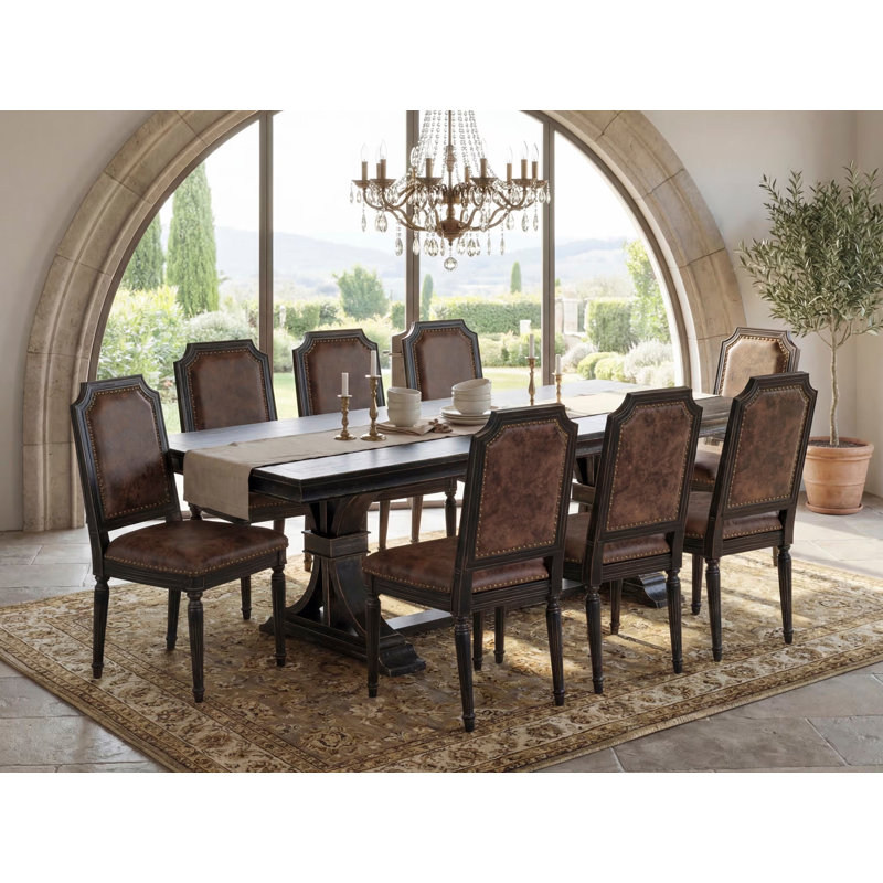 Cet ensemble de table de salle à manger 9 pièces comprend une table de salle à manger et 8 chaises de cuisine en similicuir texturé brun avec dossier haut - fini noir sablé