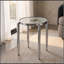 Table d'appoint ronde en chrome brillant avec pattes extérieures effilées