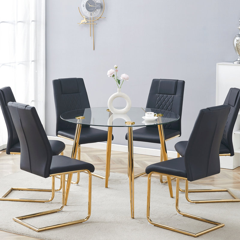 Table de salle à manger ronde en verre trempé avec pieds dorés et 6 chaises en cuir PU haut de gamme modernes pour la décoration