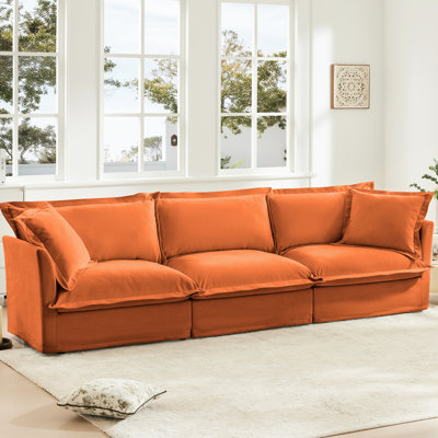 Canapé 3 places orange avec de nombreux grands coussins moelleux et une structure en bois avec housse de couleur moderne, chenille souple et respirante