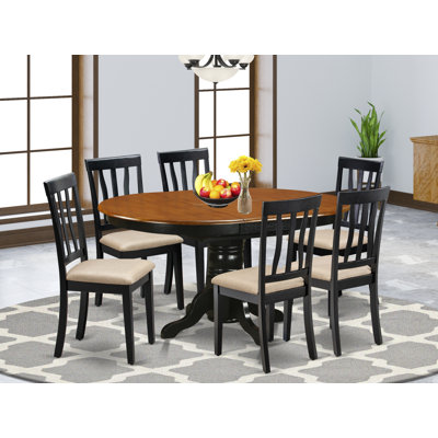 7 Piece Kitchen Table Set consists of an Oval Dining Table with Butterfly Leaf and 6 Linen Fabric Upholstered Dining Chairs