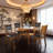 47 Inch Round Oak Finish Dining Table With Lower Shelf