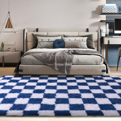 Soft, non-slip area rug with a blue-and-white striped design, ideal for bedside, children's rooms, and living rooms.