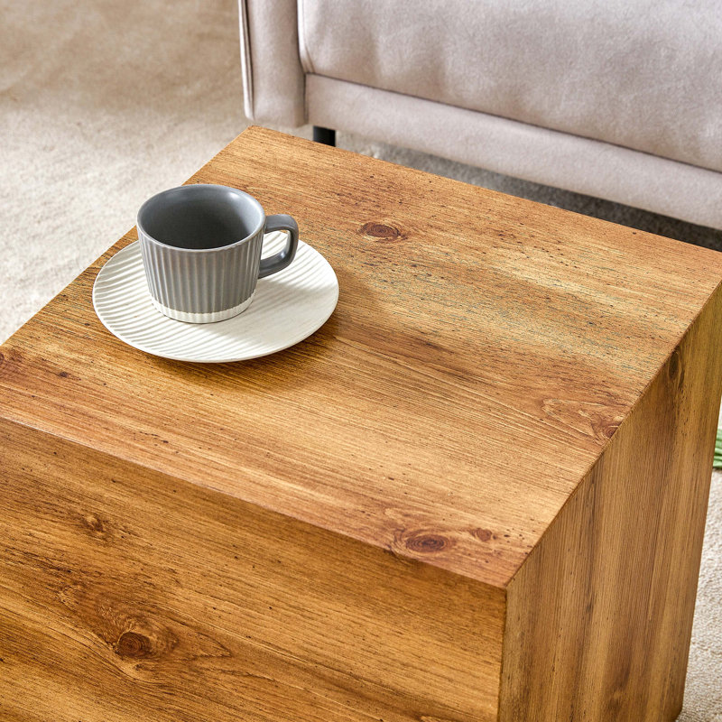 Elevate your living space with this modern MDF coffee table that showcases smooth, Wood colour texture patterns. It is characterized by stylish design.11.8*11.8*19.6 inch