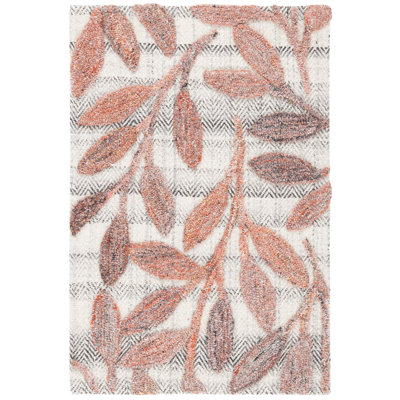 Tapis floral rouille touffeté à la main