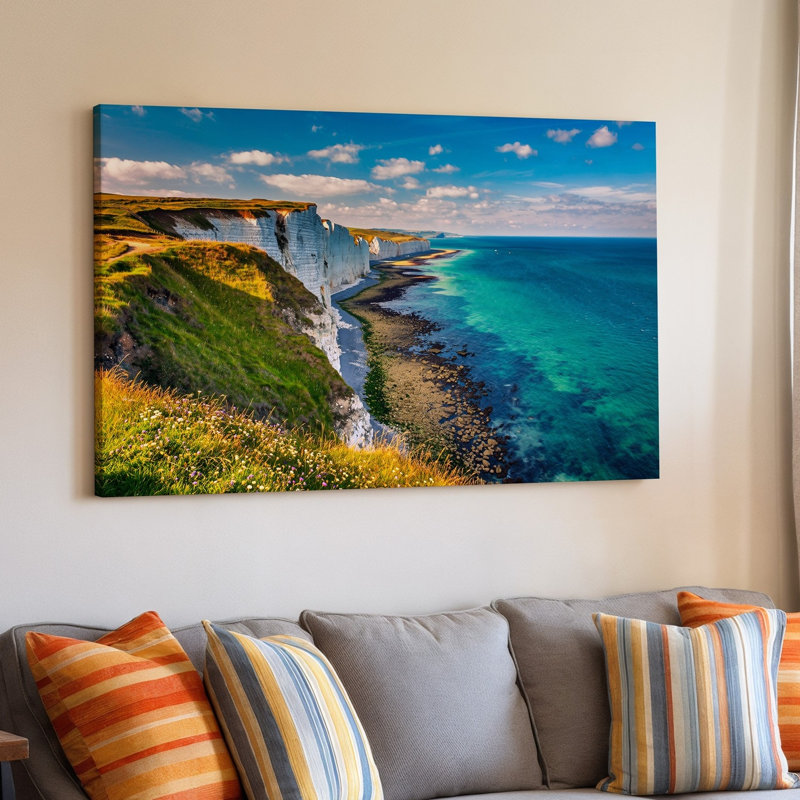 Toile, "Une scène côtière à couper le souffle avec des falaises dramatiques rencontrant un art mural vibrant, une mer turquoise sous un ciel bleu vif"