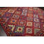 Tapis rouge géométrique en laine bouclé