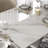 63-95" Modern Extendable Dining Table,White Glossy Sintered Stone Table top, Black Carbon Steel Base for 4-10
