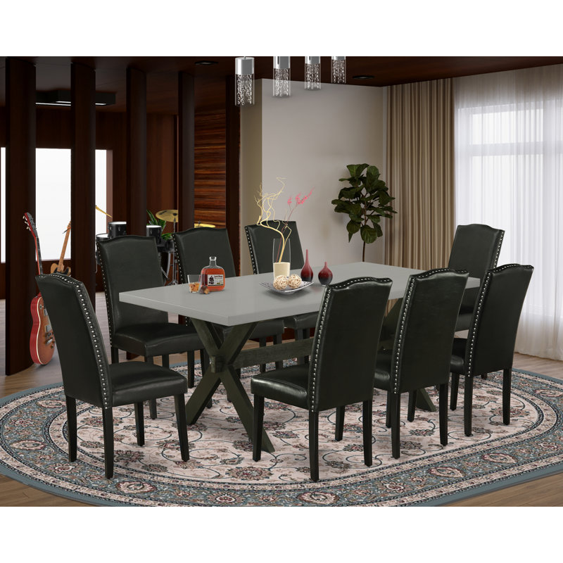 Ensemble de salle à manger 9 pièces comprenant une table de cuisine rectangulaire avec pieds en X et 8 chaises Parson revêtues de similicuir noir, noir brossé