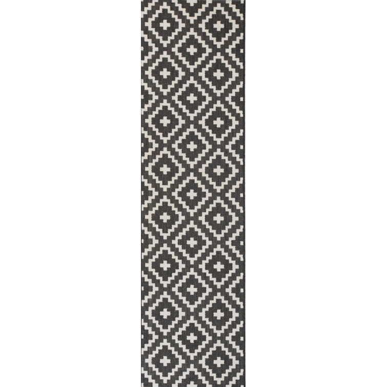 Tapis géométrique noir / blanc Boucher