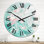 Vagues d'art vertes et roses - horloge murale moderne