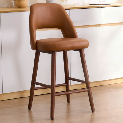 Tabouret de comptoir rembourré en similicuir Ryden avec pieds en bois