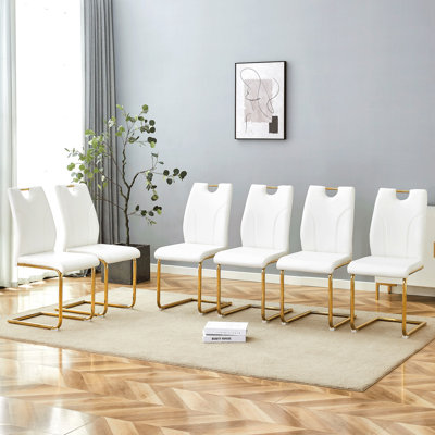 Ensemble de chaises de salle à manger en polyuréthane blanc. Chaises de salle à manger blanches de conception unique. Matériau en polyuréthane, jumelé avec des pieds de chaise en métal doré. Convient aux bureaux, restaurants, cuisines, salles de conférence, etc. (ensemble de 6)