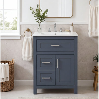Meuble-lavabo de 24 po avec lavabo en céramique - structure en bois massif et armoire en panneau de fibres à densité moyenne, finition bleue, 1 porte et 3 tiroirs (rabattable, peu profond, profond), charnières à fermeture en douceur, tablette réglable, poignées argentées pour les petites salles de bain