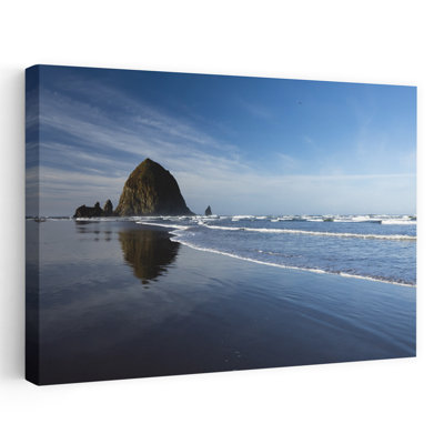 View Of Rock Formations Close To Coastline Cannon Beach Oregon USA by Dan Merkel - Wrapped Canvas Print