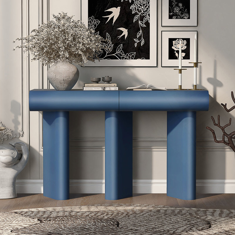 Table d'entrée moderne avec tiroirs courbés et pieds géométriques pour un rangement peu encombrant dans les petits espaces.