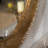 31.3 Inch Gold Textured Round Wall Mirror With Iron Frame And MDF Back, Perfect Boho Accent For Living Room Or Bedroom