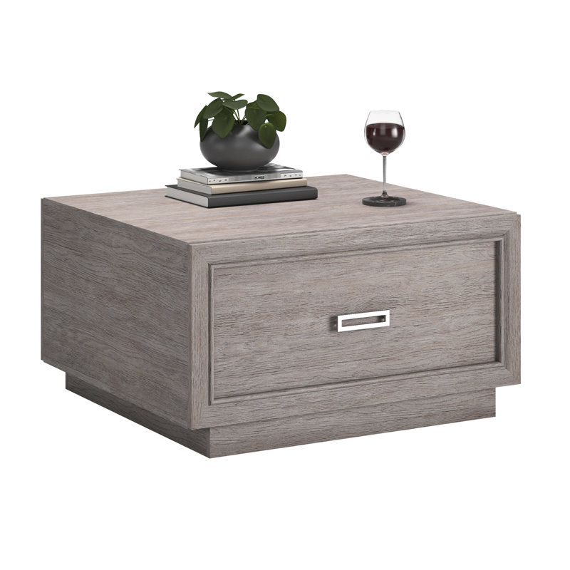Table basse grise avec tiroir coulissant lisse et tablette ouverte, design moderne pour les salons, gris moyen compact avec un rangement spacieux, ajout élégant aux espaces, simple