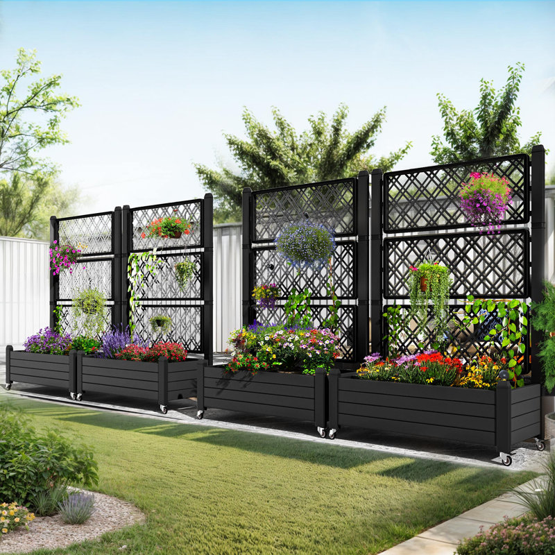 Boîte à fleurs noire avec treillis et roues verrouillables