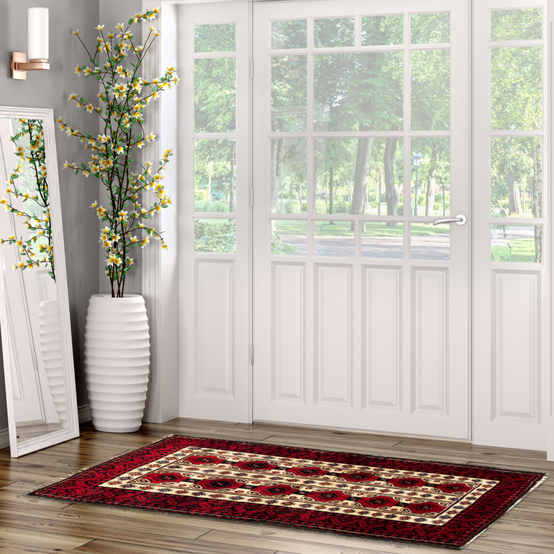 Tapis crème / rouge en laine noué à la main