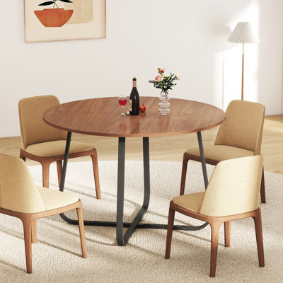 Table de salle à manger ronde moderne en noyer avec pieds croisés en métal robuste