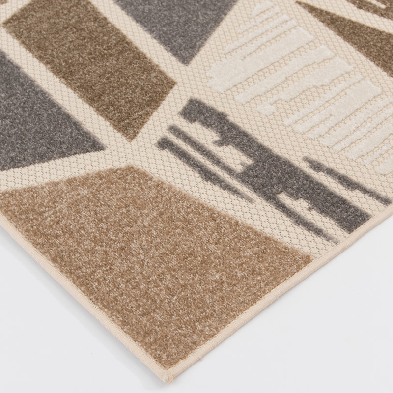 Ivory and Taupe Geometric 5' x 7' Synthetic Area Rug
