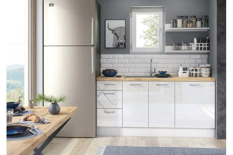 modern gray kitchen with a white base cabinet, silver refrigerator, and white backsplash