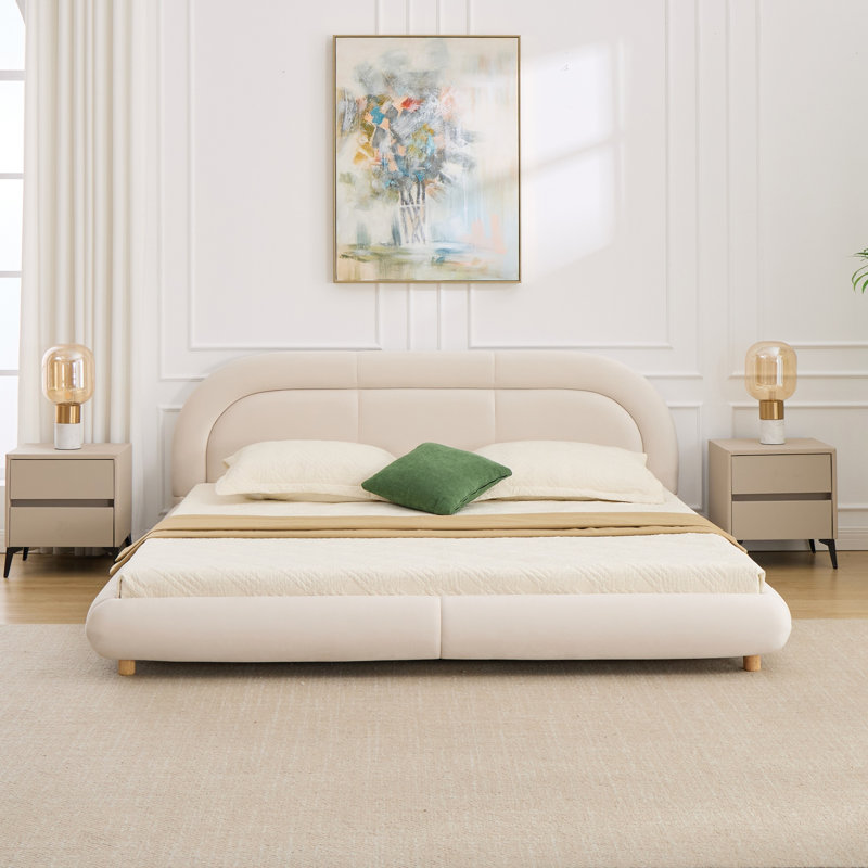 Très grand lit plateforme tapissier à profil bas avec tête de lit arrondie, Beige