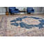 Tapis turc rétro bleu et beige avec un élégant motif en médaillon qui ajoute une touche unique à votre décor