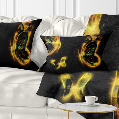 Coussin décoratif à imprimé floral jaune sur fond noir