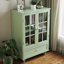 Armoire de salle à manger contemporaine avec portes et tiroir en verre double - menthe. Qualité fine, robustesse des pieds en bois massif, protection trempée. Tablette réglable, espace pratique.