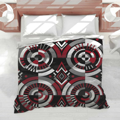 Édredon circulaire noir et rouge