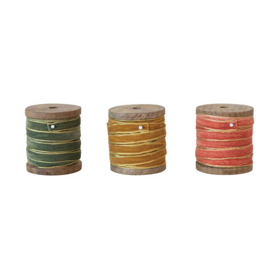 Ruban de velours avec bords métalliques sur bobine de bois