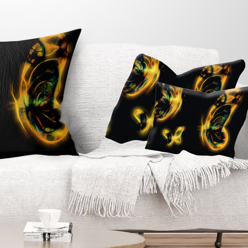Coussin décoratif à imprimé floral jaune sur fond noir