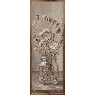 Bouquet de fleurs sauvages dans un pot en verre