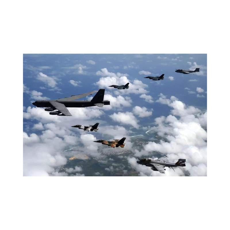 A B-52 Stratofortress Leads A Formation Of Aircraft Over Guam I by Stocktrek Images - Wrapped Canvas Print
