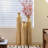 Set Of Three Distressed Metal Decorative Vases With Etched Vine Motifs, Tall Centerpiece Vases For Elegant Home Styling.