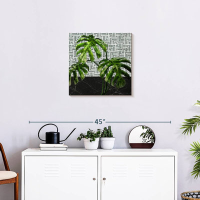Harnek Monstera feuilles sur marbre noir et carreaux
