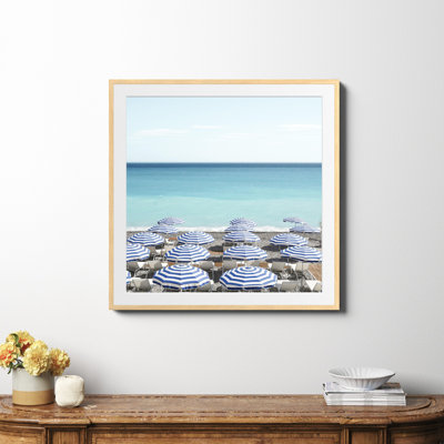 Blue Beach Umbrellas Photo by Henrike Schenk
