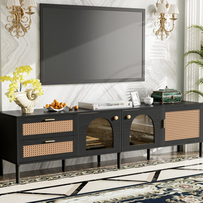 Meuble télé compatible avec téléviseur 80 pouces, design élégant, noir, avec rangements multifonctionnels.