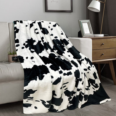 Couverture en peluche noire et blanche pour toutes les saisons