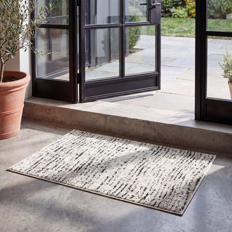 Riebe Abstract Ivory/Silver Area Rug