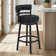 Deherrera Modern Swivel Counter or Bar Stool with Open Low Back and Footrest in Metal and Faux Leather